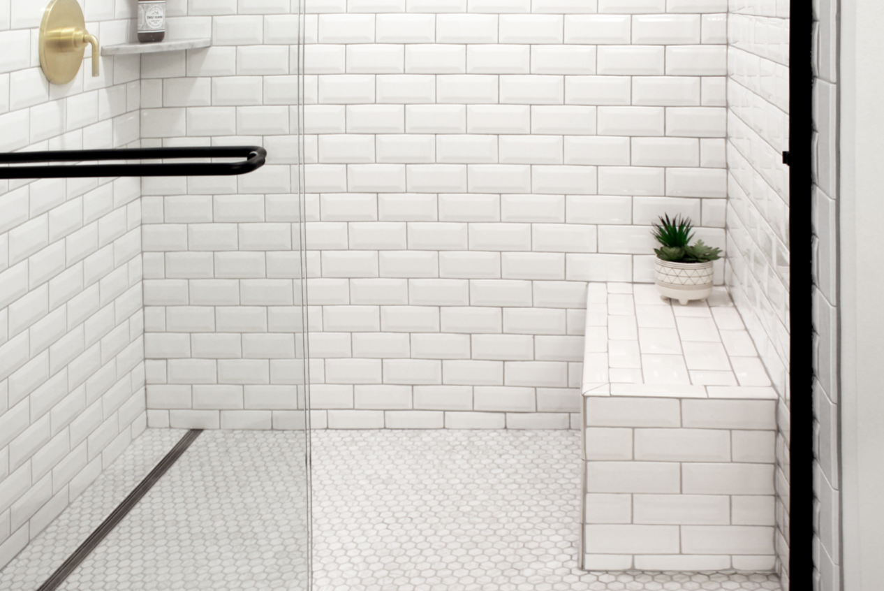 Large tiles inside a linear drain shower system reduce the chances of grout
